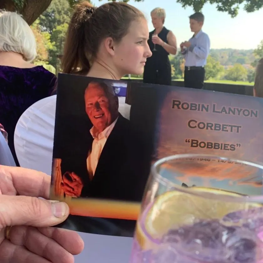 “A pic from his memorial last Friday. That’s my daughter sitting there by chance and my sister and her son speaking”. Dave Corbett, son of R