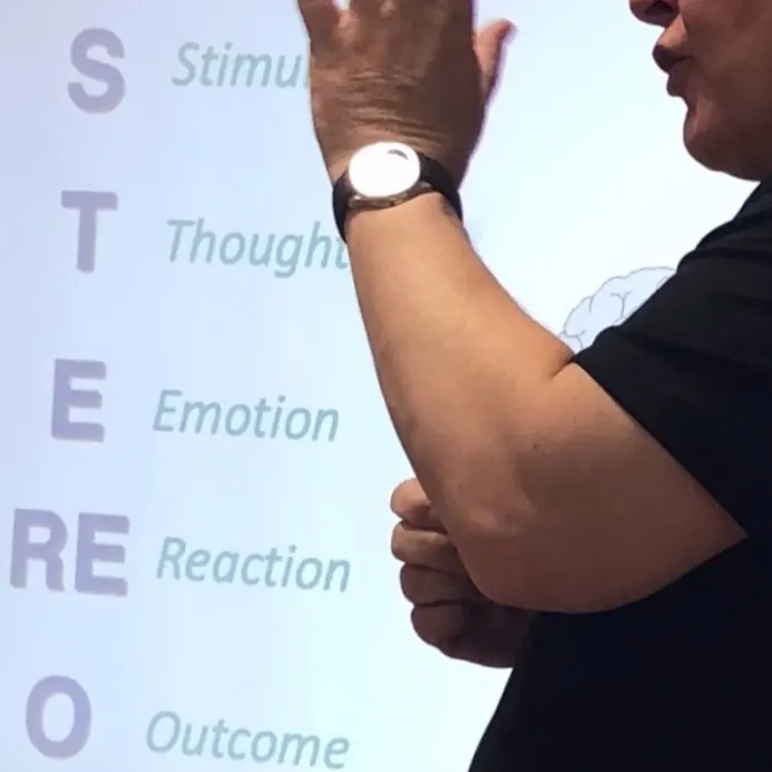 Paul Roebuck presenting his STEREO model: stimulus, thought, emotion, reaction, outcome
